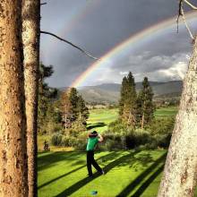Golfing at Altitude Mountain golfing under a rainbow